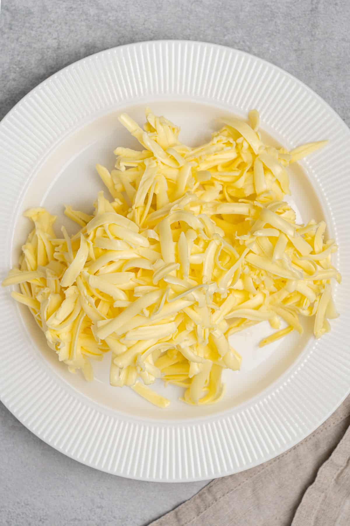 Grated butter on a plate.