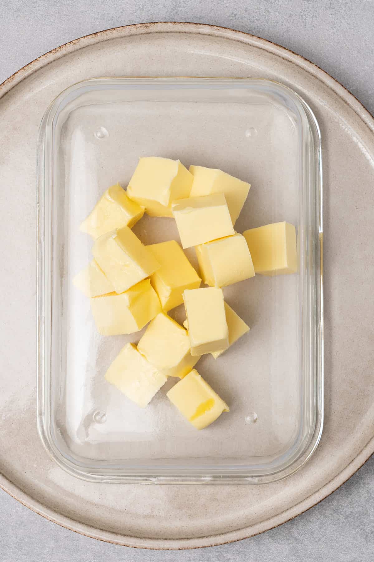butter cubes under a glass.