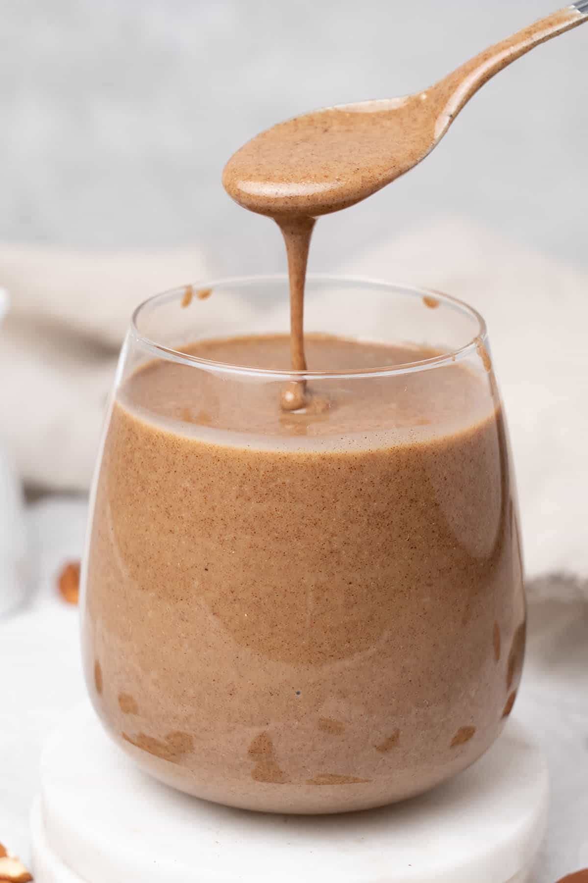 Pecan butter in a glass.