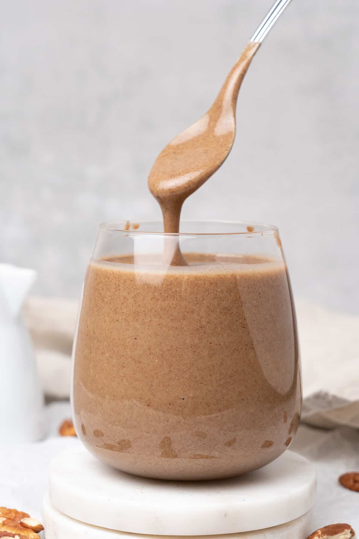 Pecan butter in a glass.