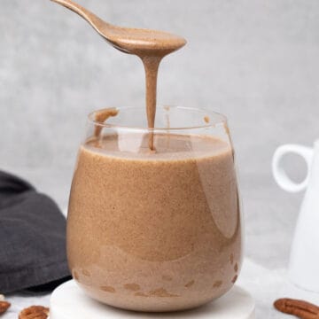 Pecan butter in a glass.