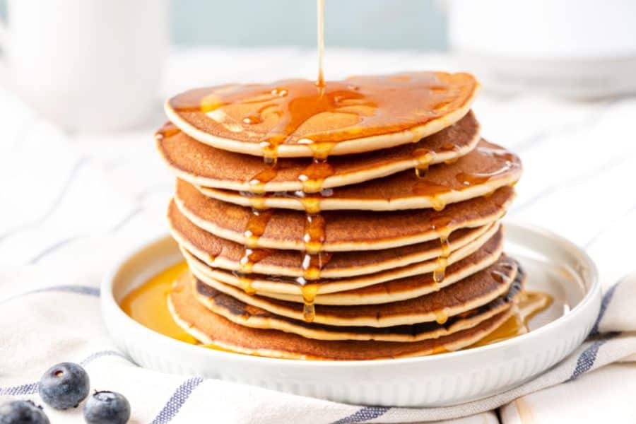 pancakes with honey on top.