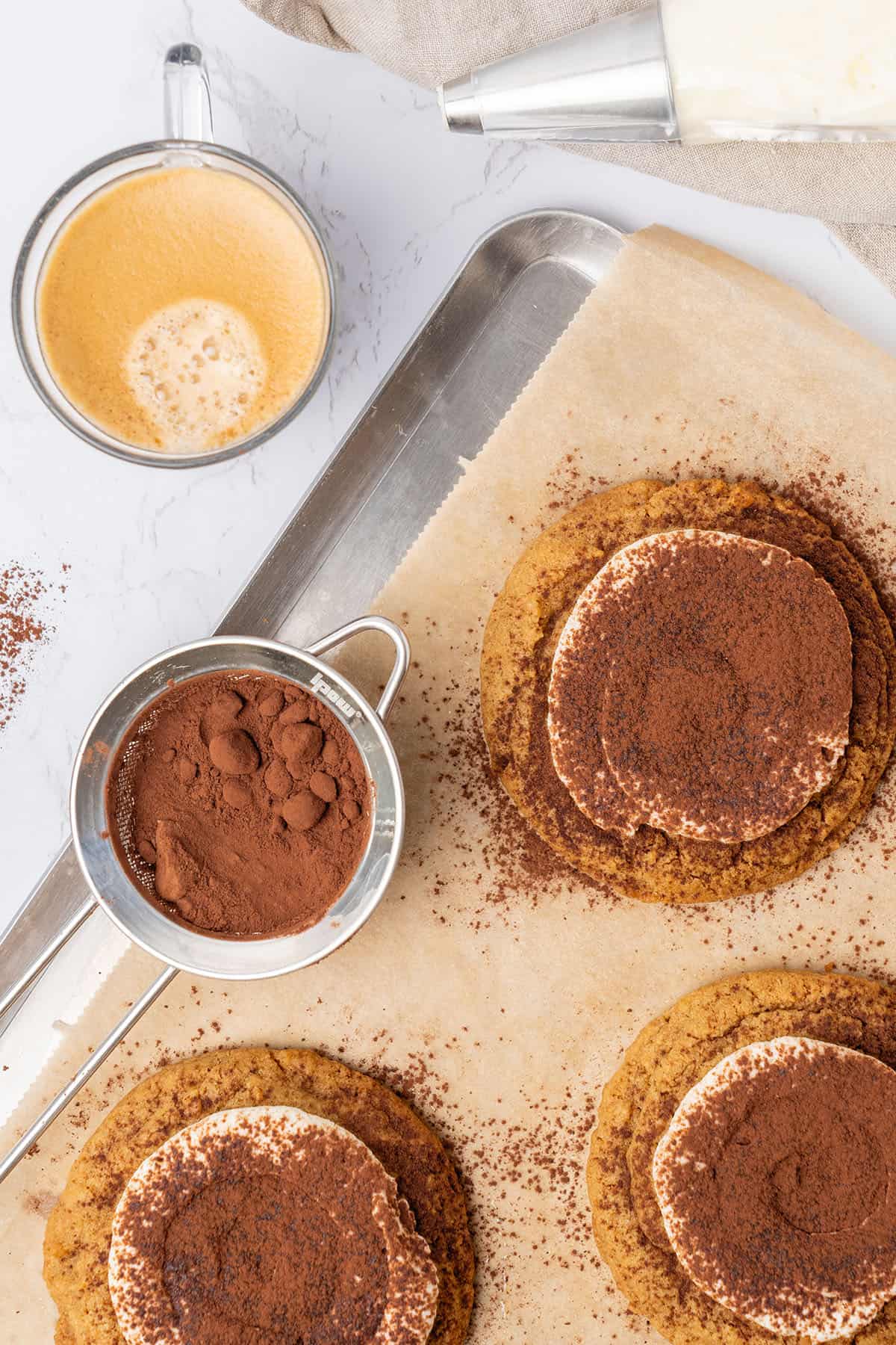 Tiramisu cookies on a baking tray.