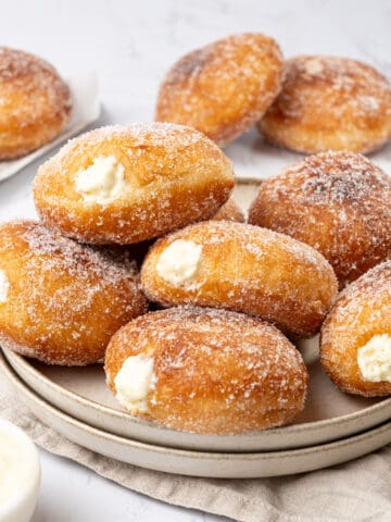 Bavarian cream donuts on a plate.