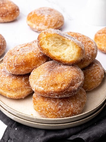 Brioche donuts on a plate.