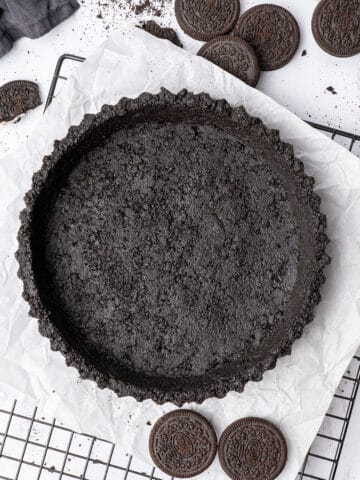 Oreo pie Crust on a cooling rack.