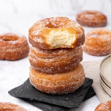 Sugar donuts on a plate.