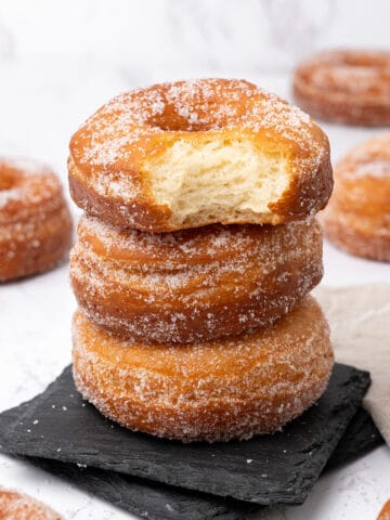 Sugar donuts on a plate.