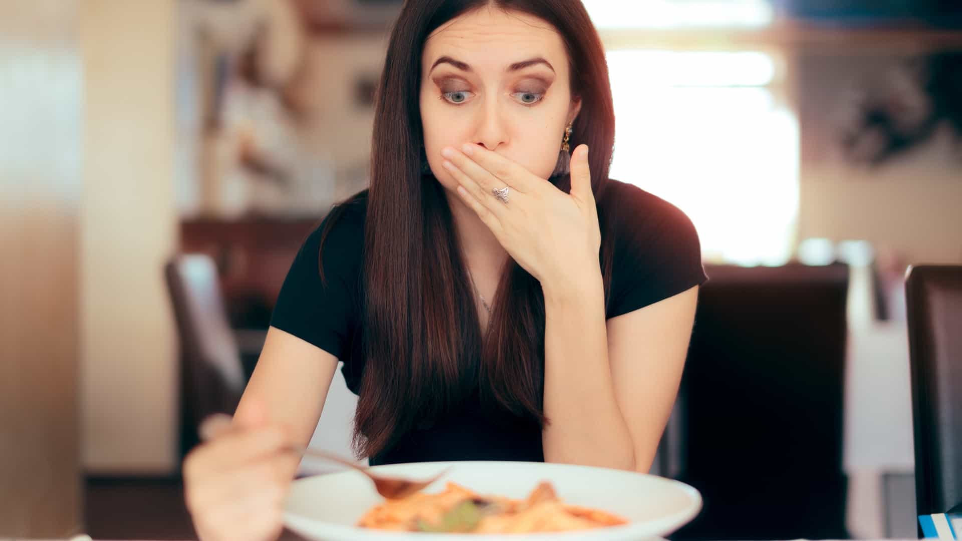Woman feeling sick from food