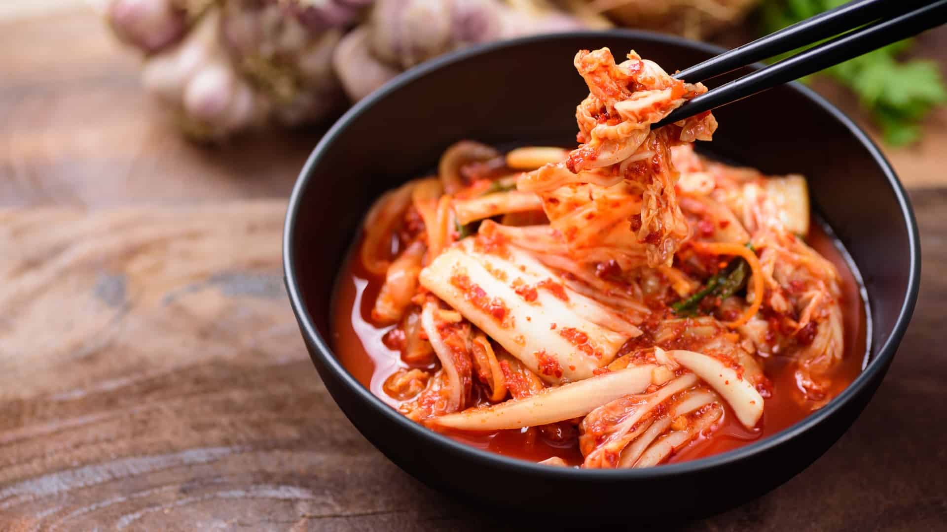 Bowl of kimchi with chopsticks