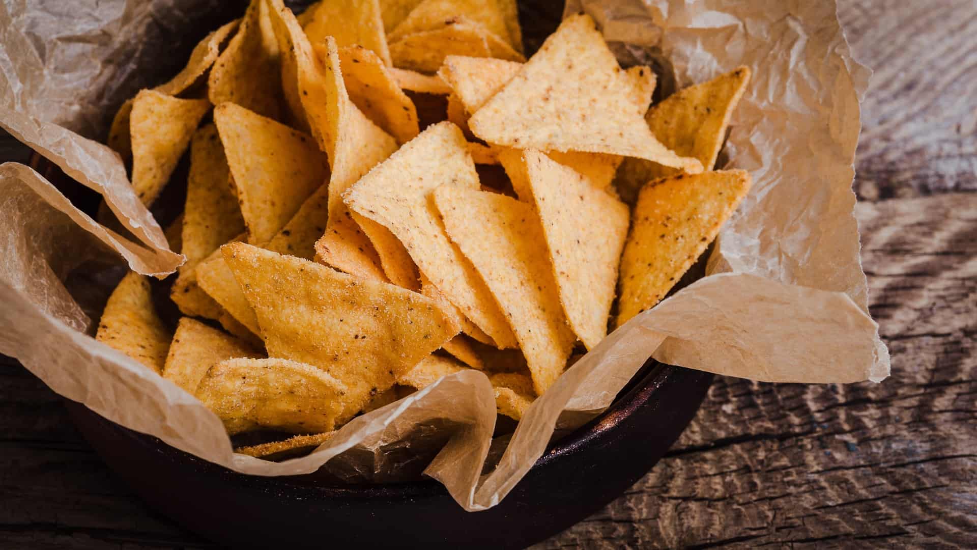 tortilla chips in a brown kraft bag
