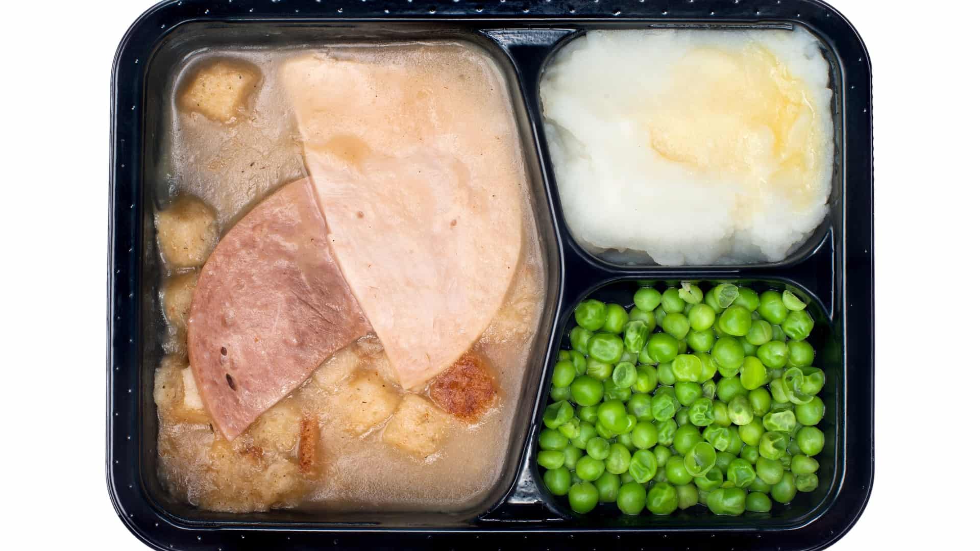 Microwave turkey dinner with mashed potatoes and peas