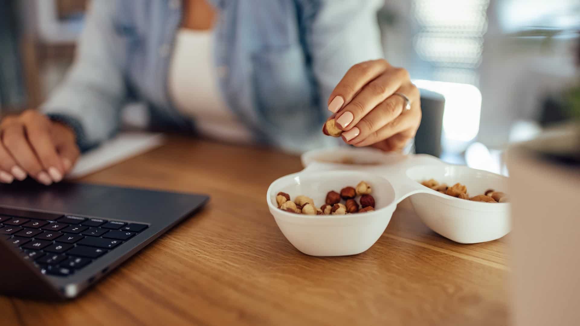 Woman working while snacking