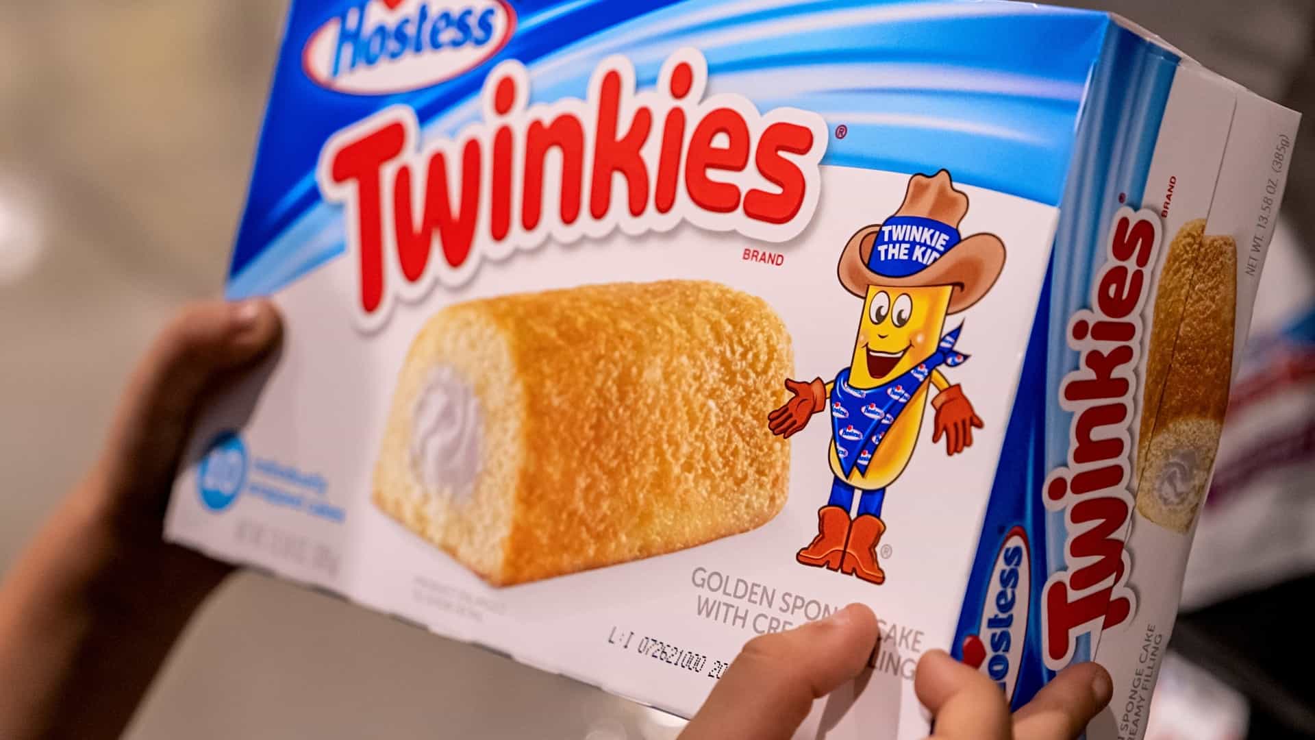 Woman holding box of twinkies