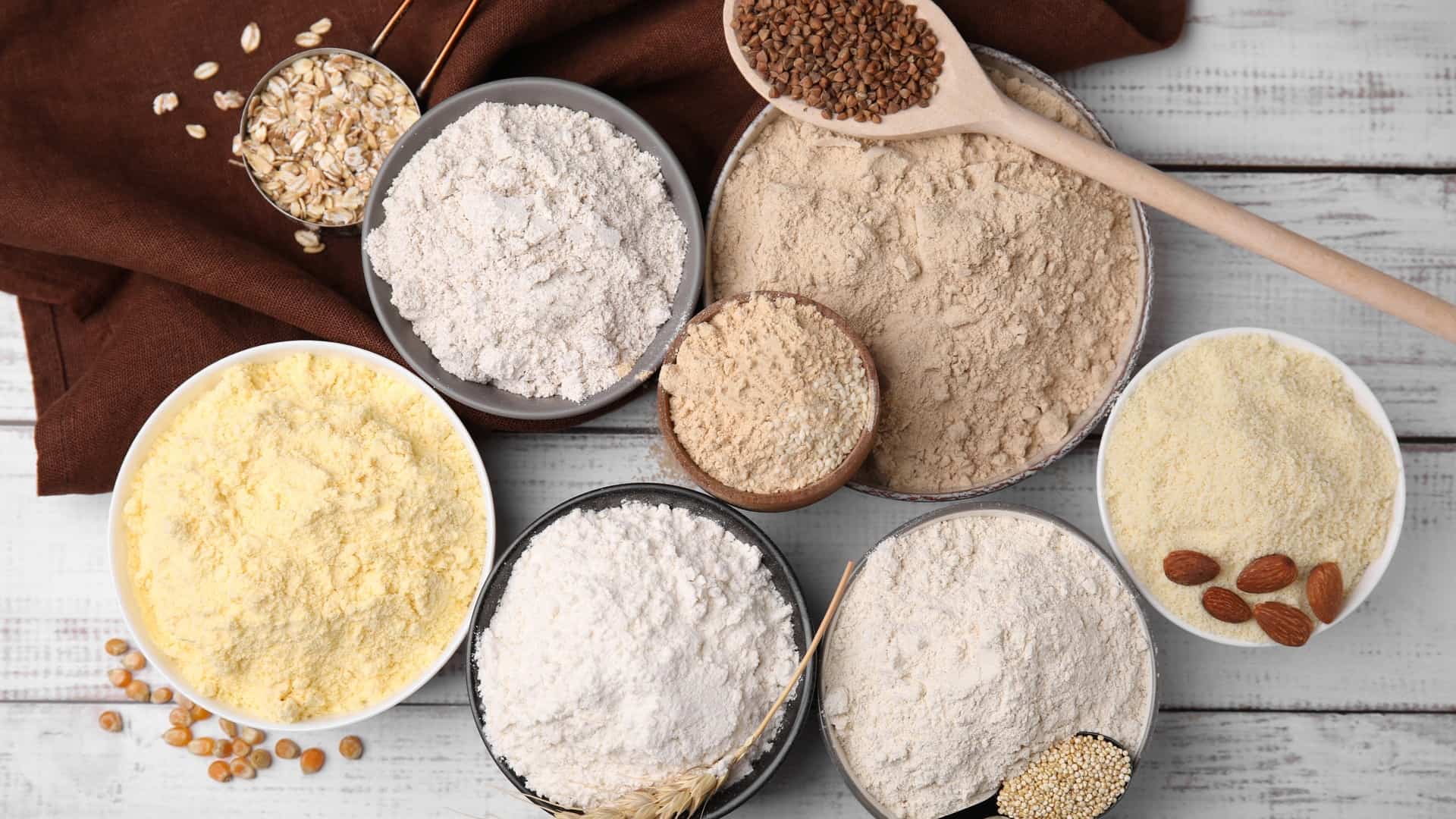 Types of flour in bags on a table