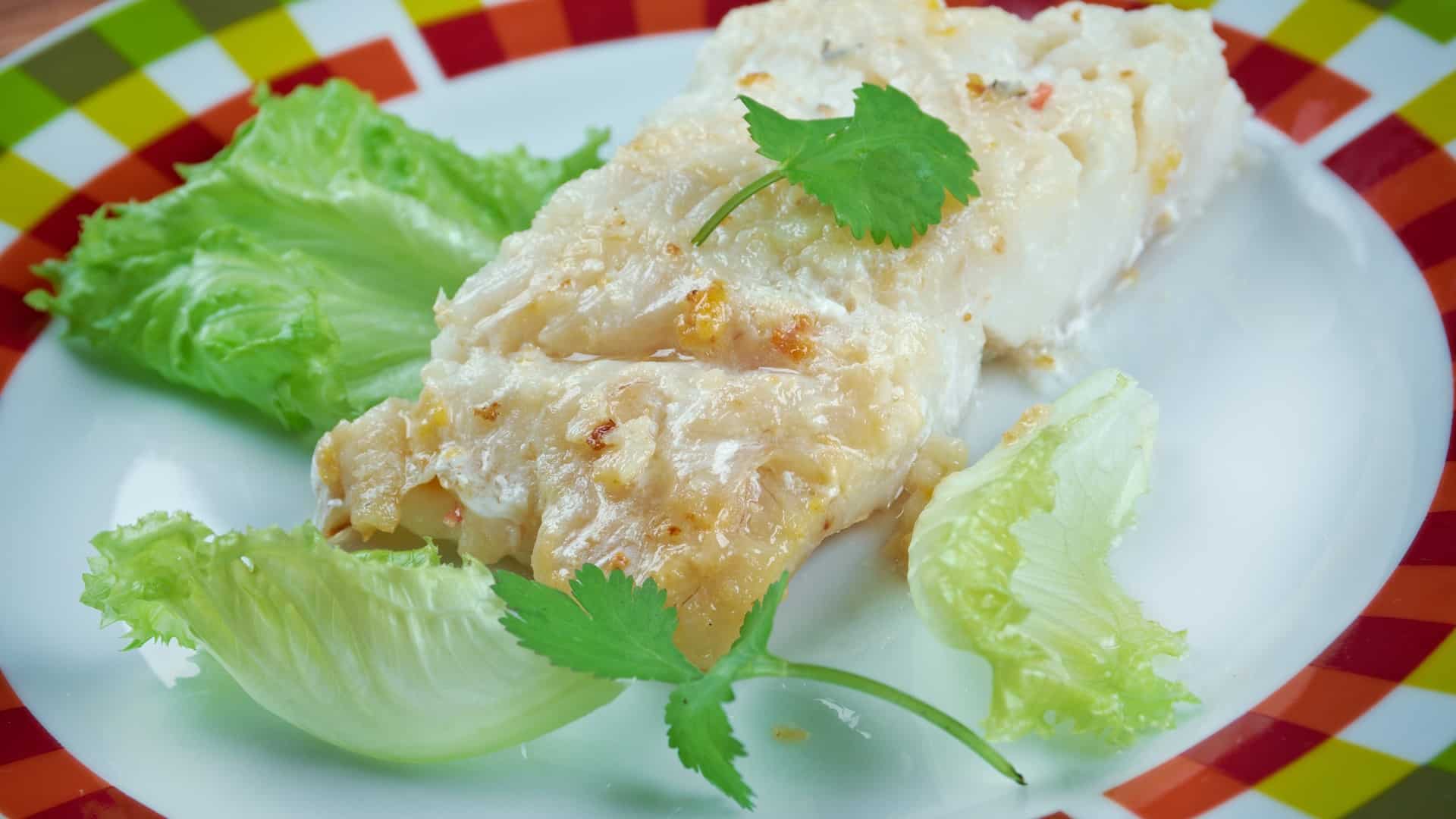 lutefisk on a plate with lettuce