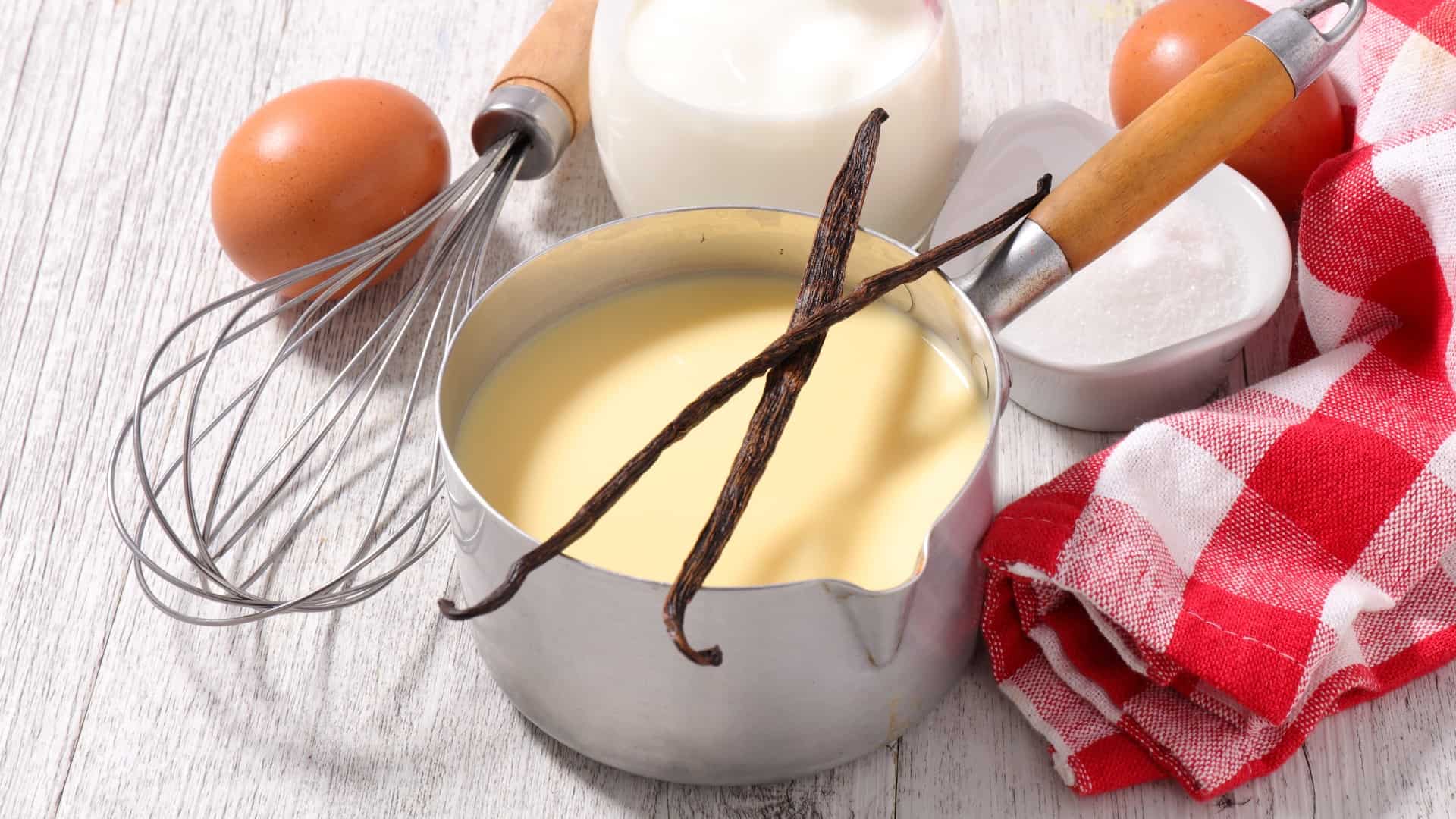 Pot of creme anglaise with vanilla beans