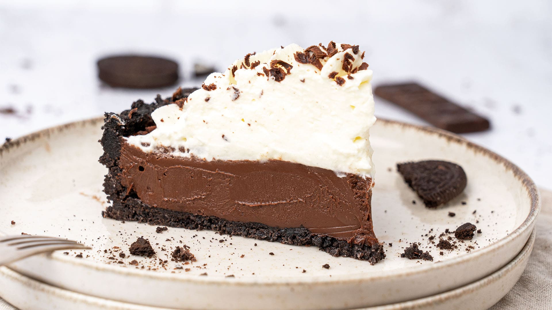 a slice of No-bake chocolate pie with chantilly cream.