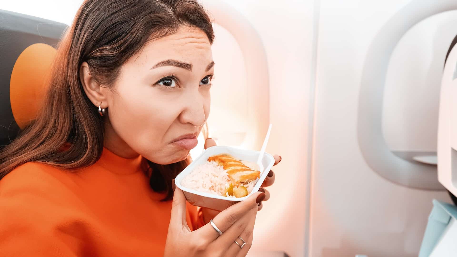 Woman smelling bad food