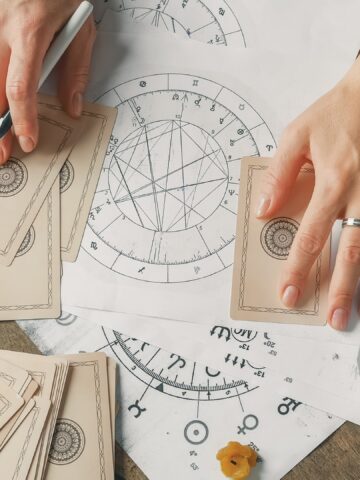 Women predicting future with astrology