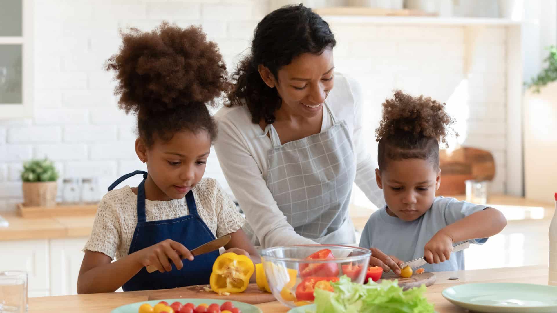 mom and kids prepare food.