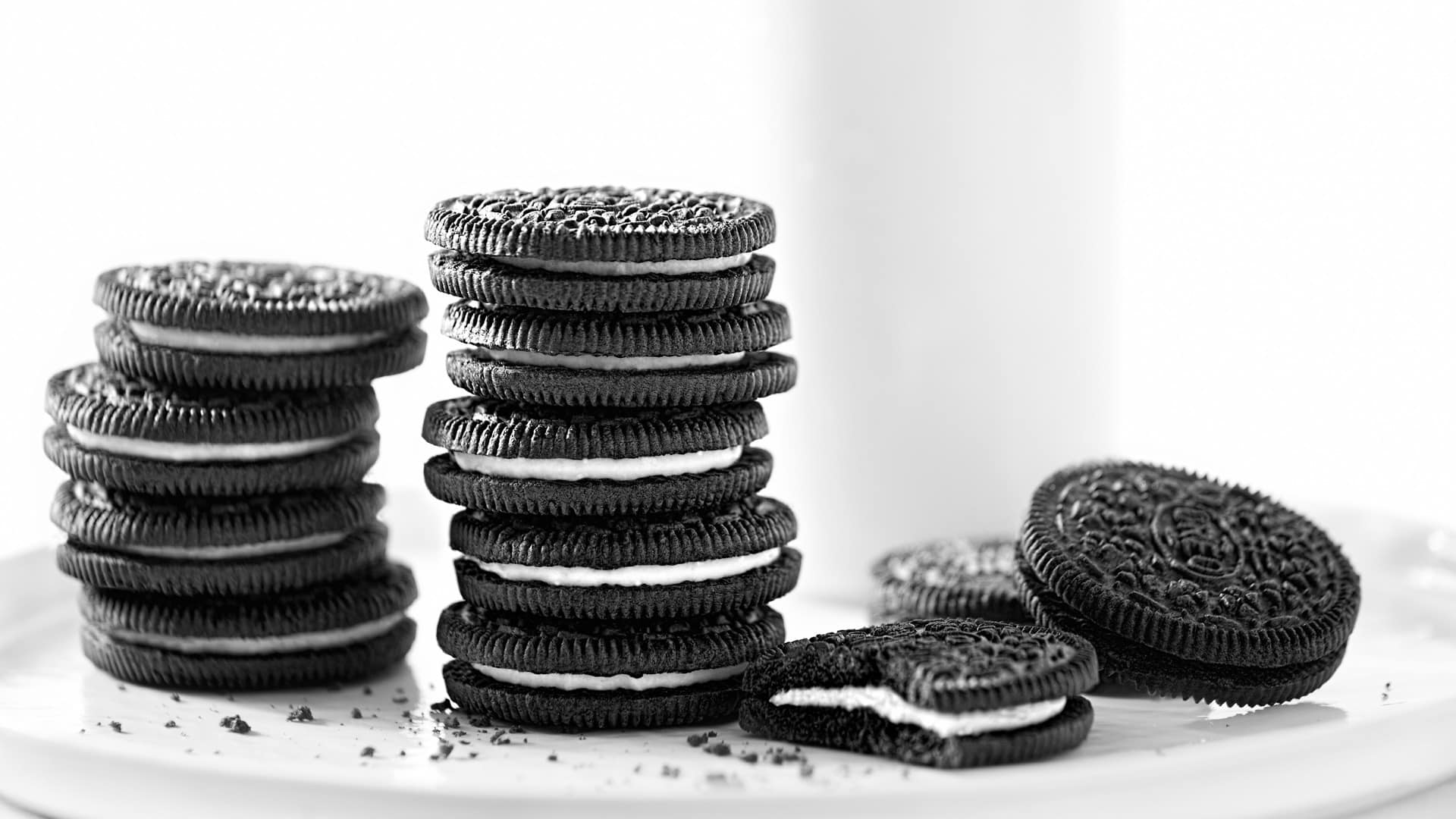 stacks of Oreos with glass of milk
