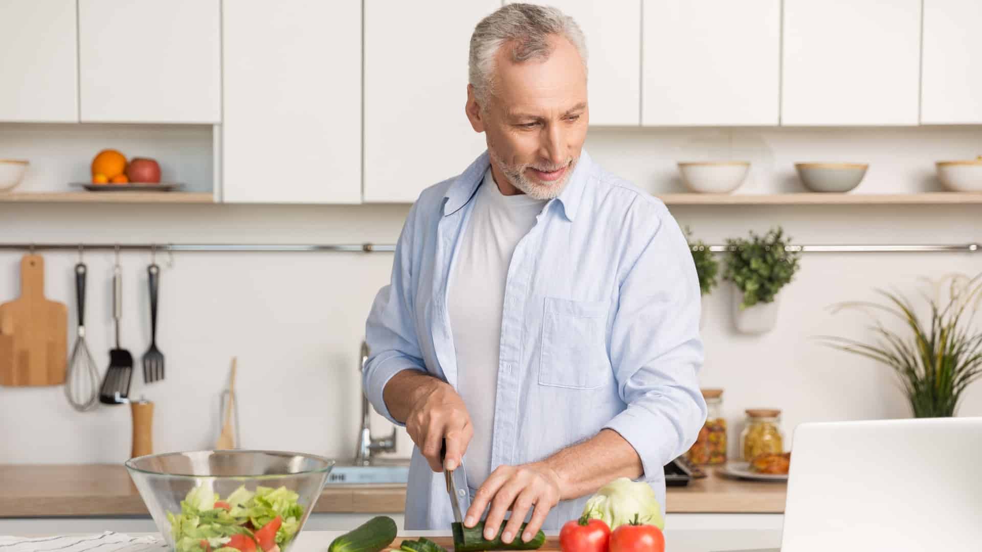 Baby boomer making food using recipe