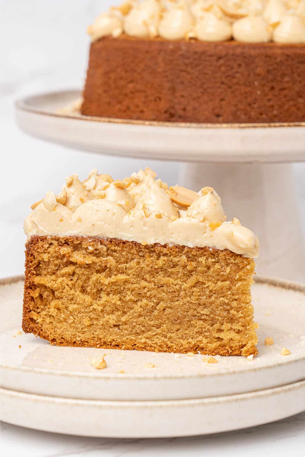 a slice of Peanut butter cake on a cake on a plate.