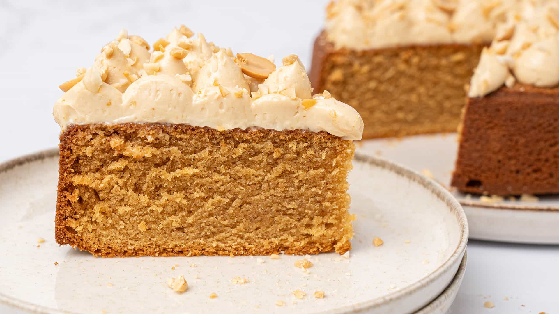 a slice of Peanut butter cake on a cake on a plate.