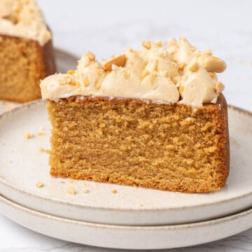 a slice of Peanut butter cake on a cake on a plate.