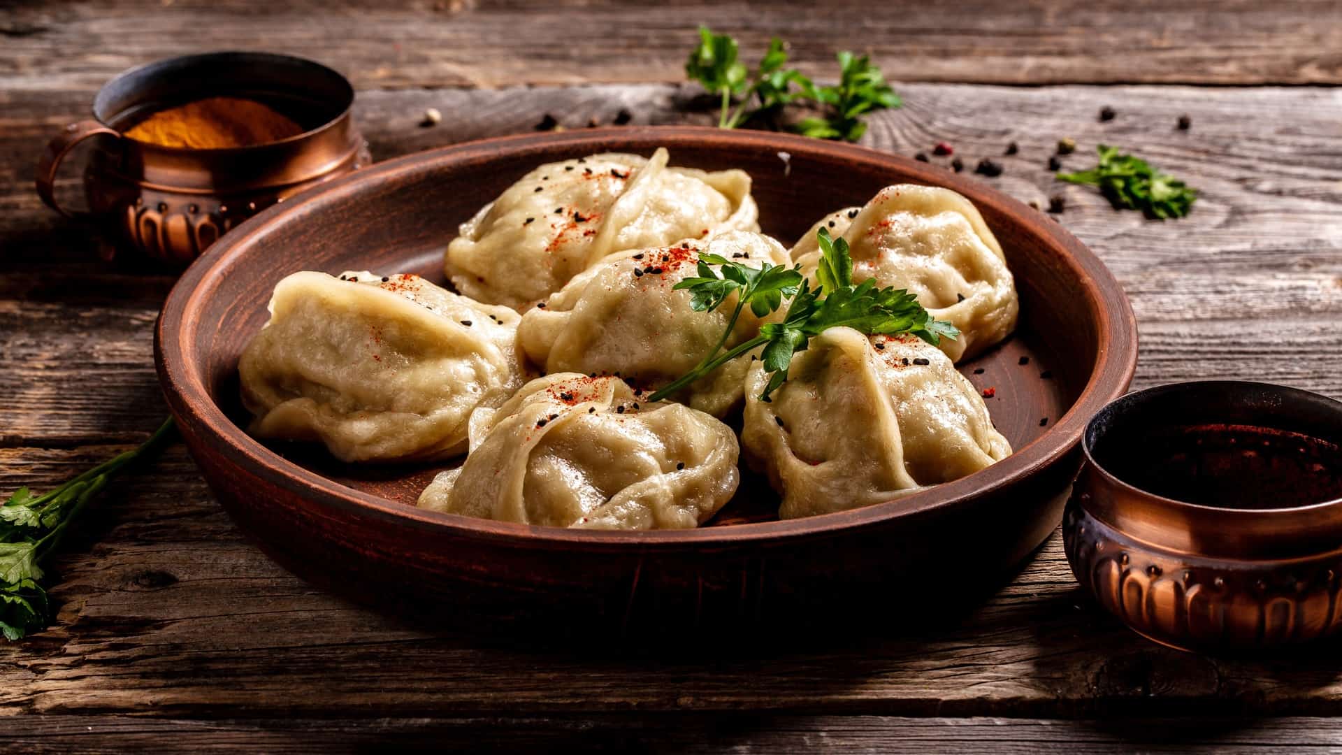 guotie dumplings in a brown bowl