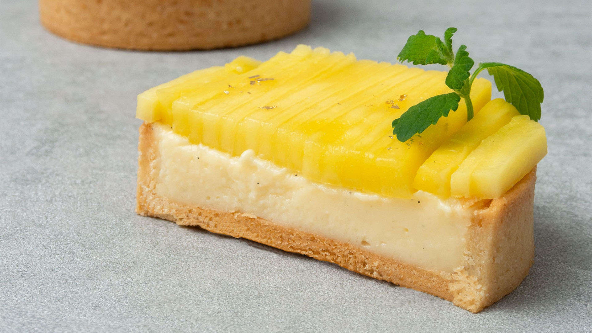 a half mango vanilla tart.