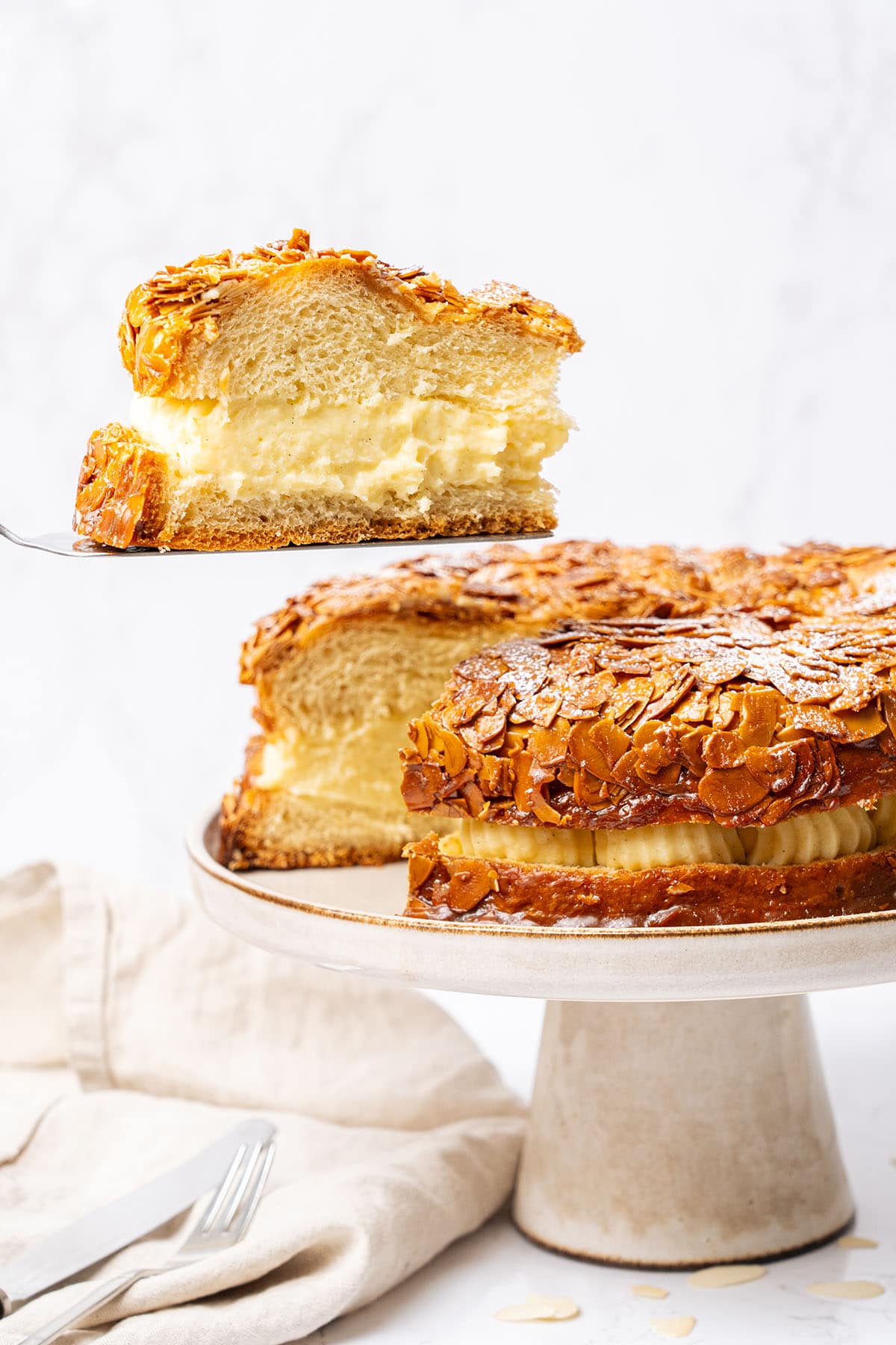 a slice of german bee sting cake on a plate.