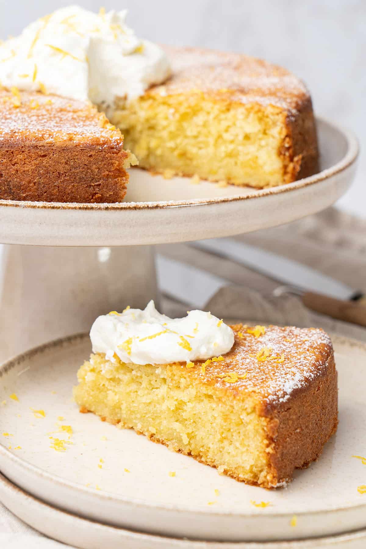 a slice of Italian Lemon Ricotta Cake on a plate.