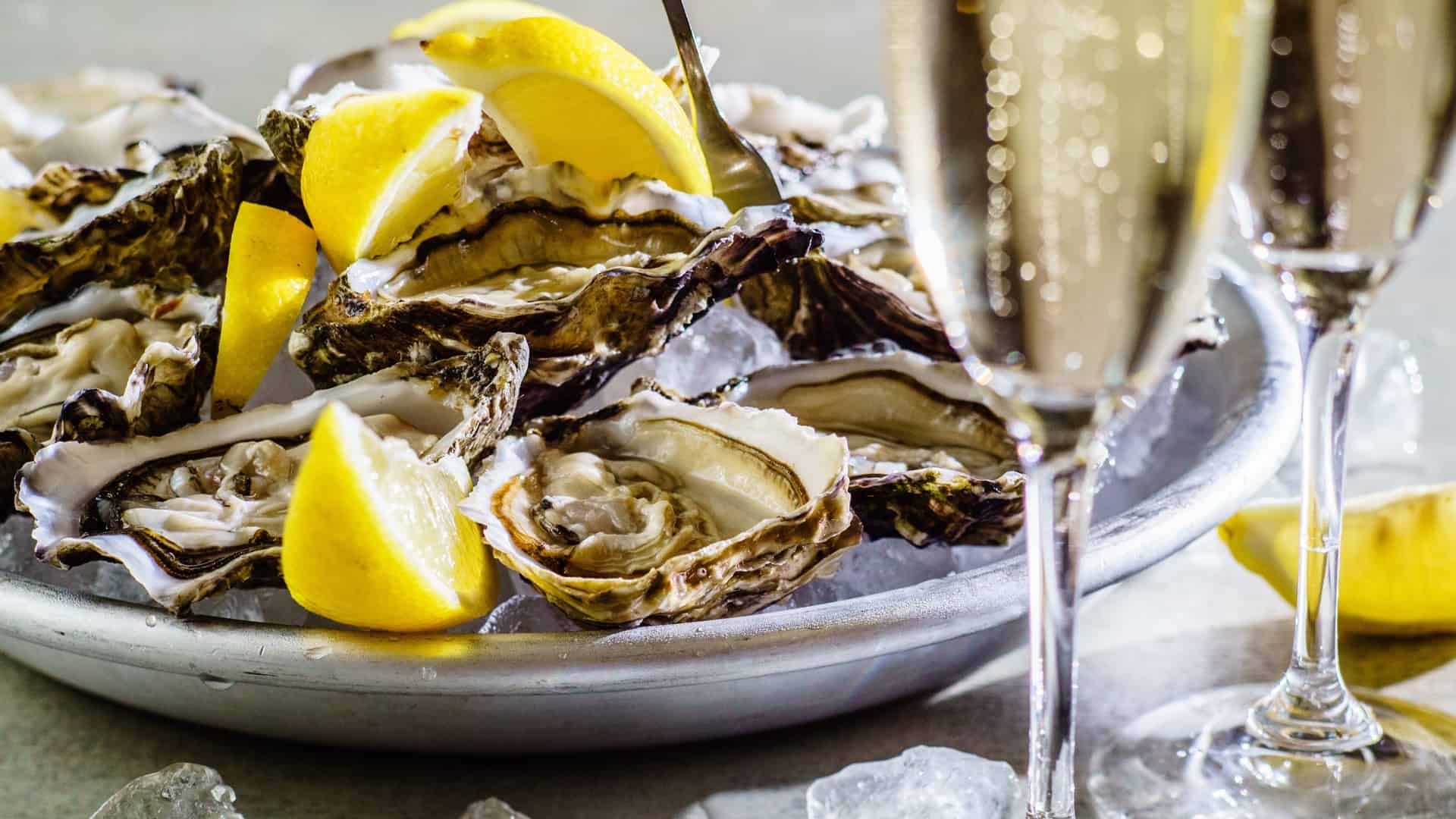 champagne and oysters on a playe