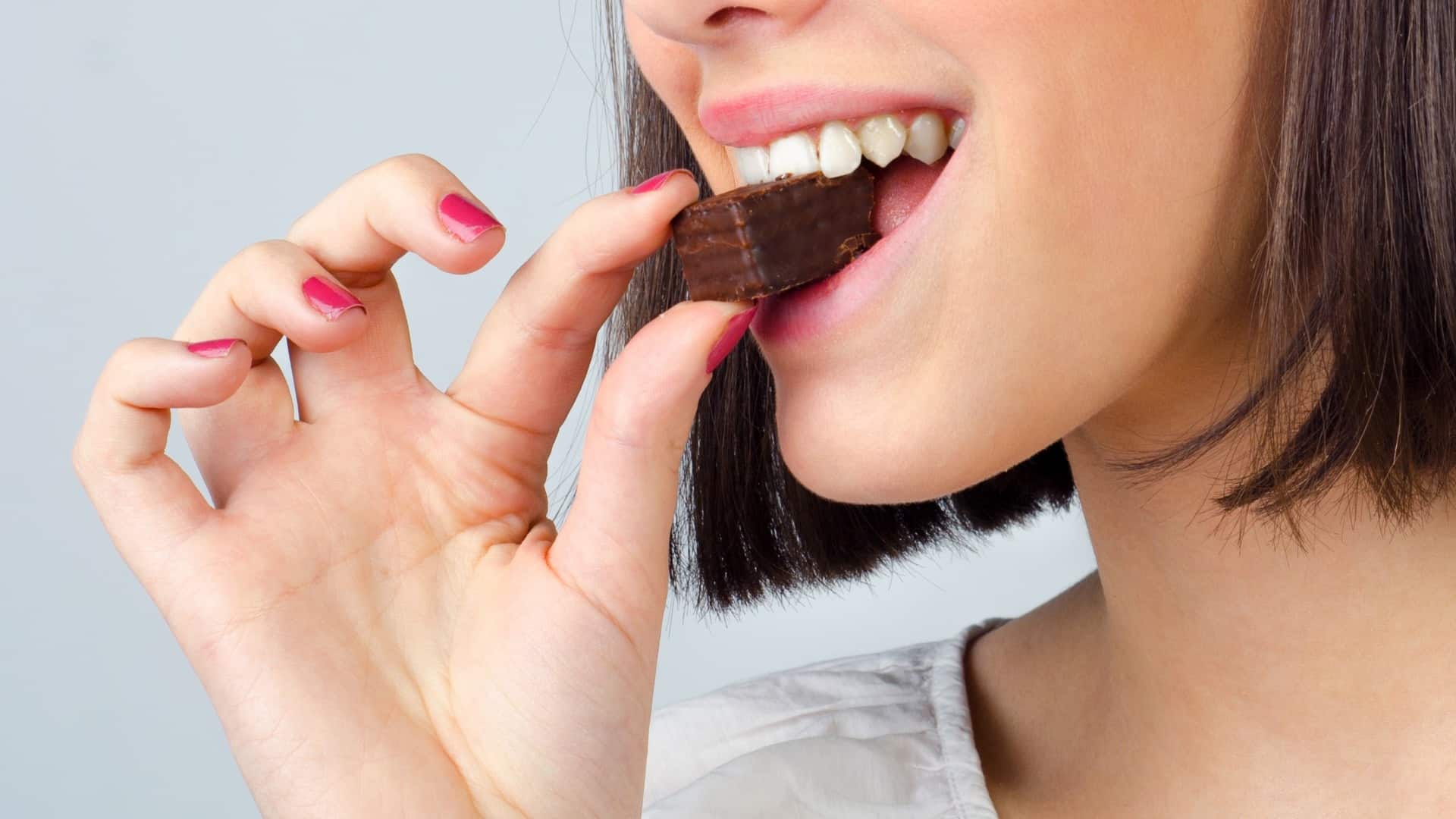 woman eating chocolate