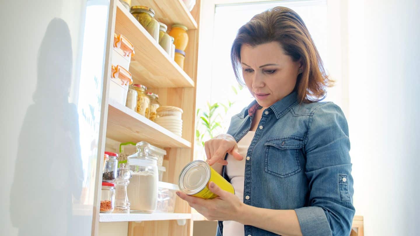 Woman checking expiring date.