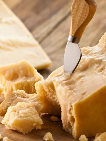Cheese on a cutting board.