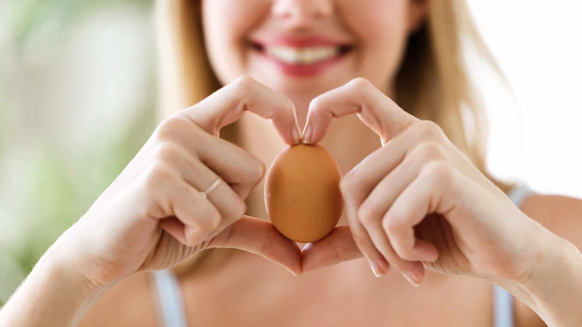 pretty woman holding an egg