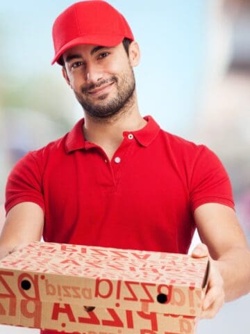 pizza delivery guy with pizza boxes