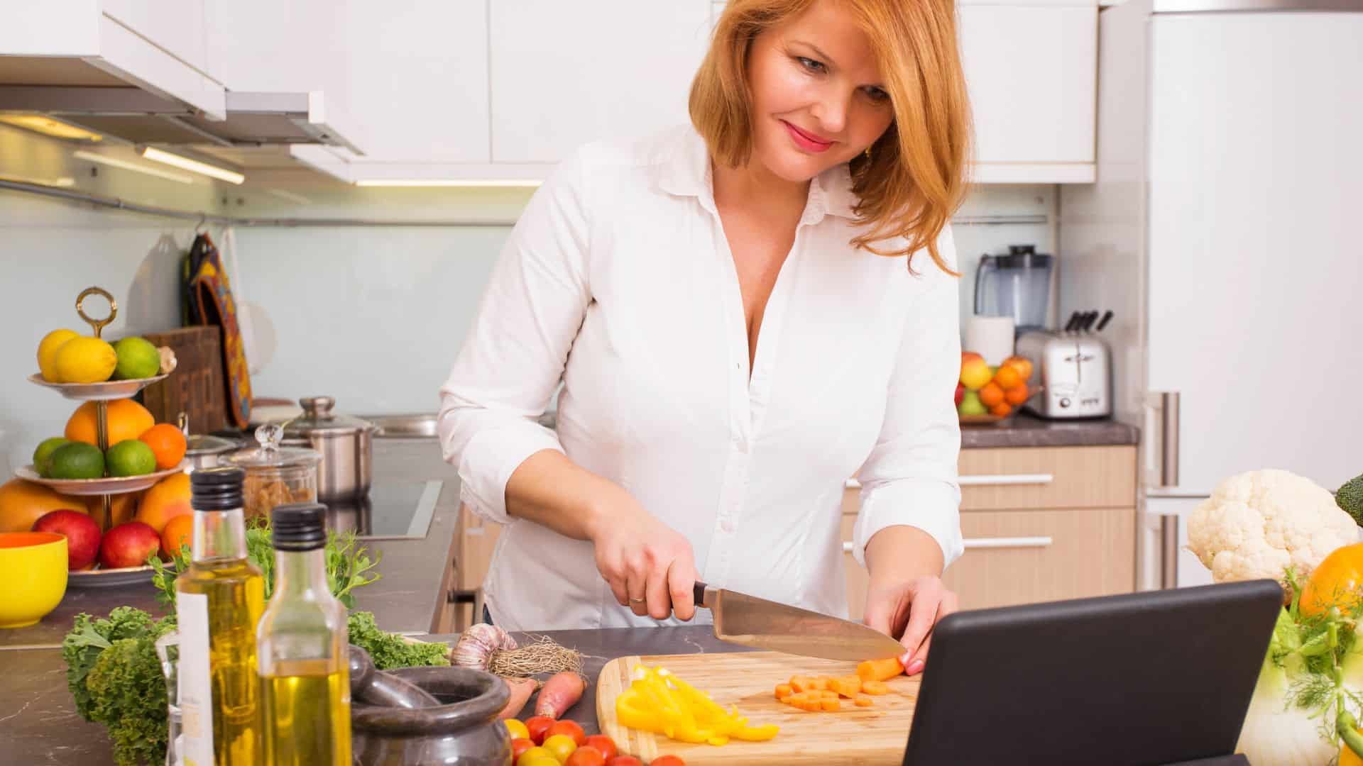 woman cooking with ipad