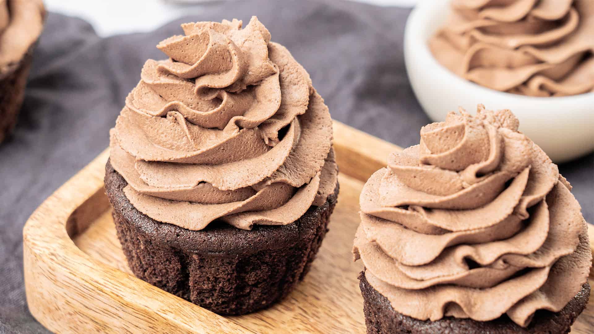 Chocolate whipped cream frosting on a cupcake.