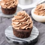 Chocolate whipped cream frosting on a cupcake.