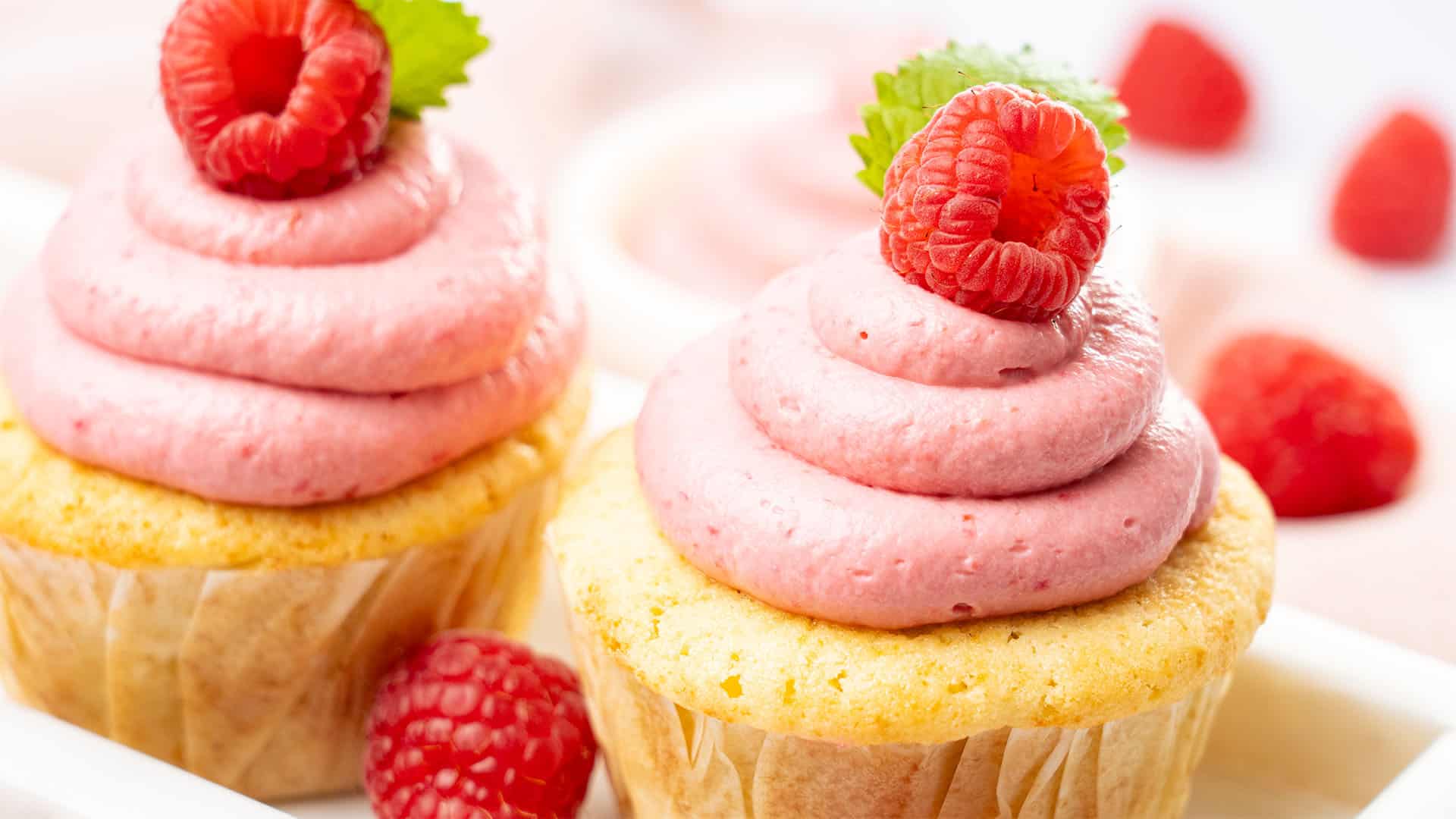 Raspberry cream cheese frosting on a cupcake.