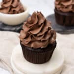 Chocolate buttercream frosting on cupcakes.