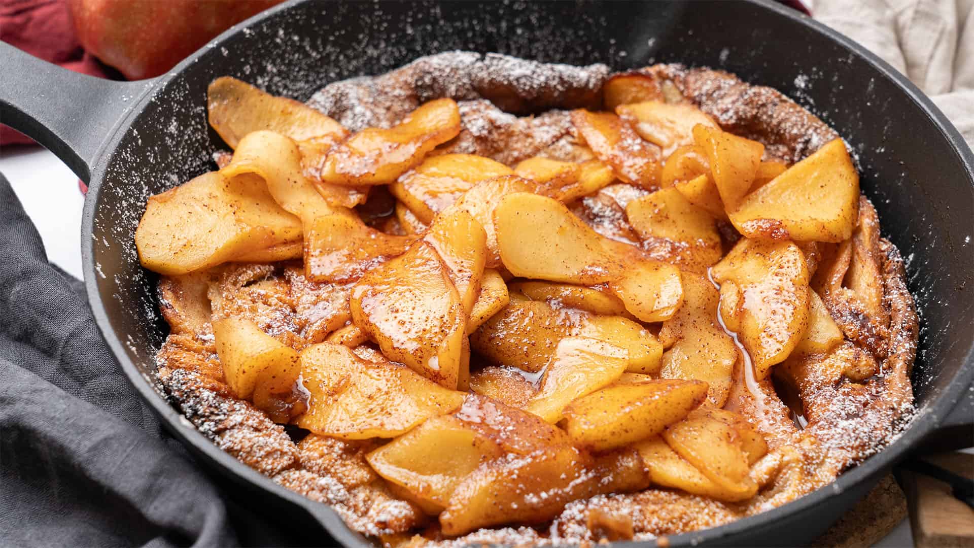 Apple Dutch Baby in an iron skillet.