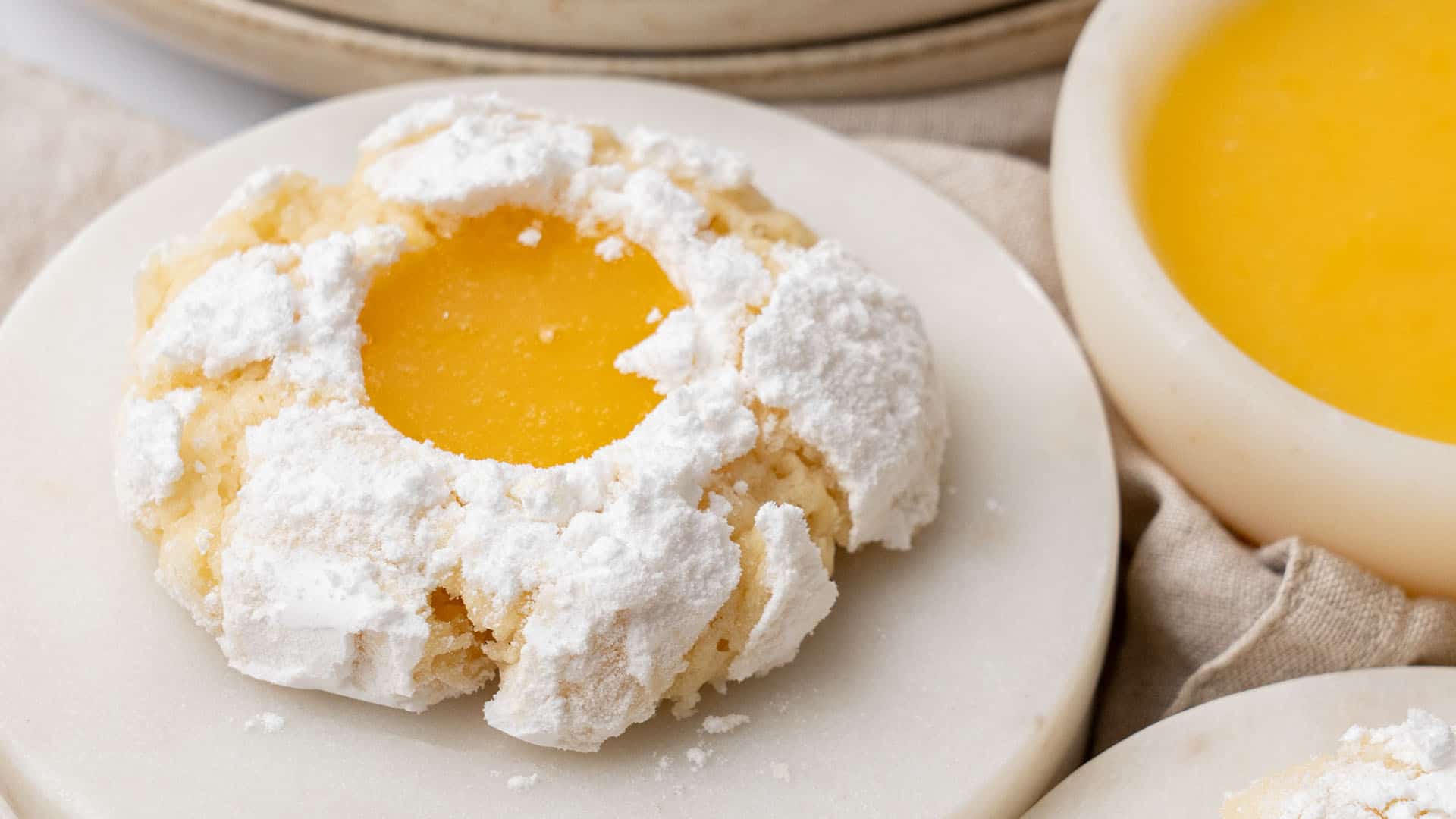 Lemon curd cookies on a plate.
