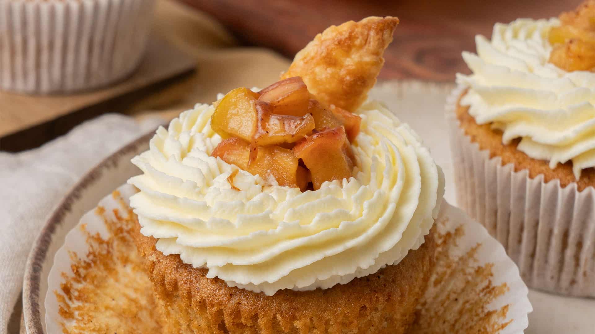 apple pie cupcakes on a cutting board.