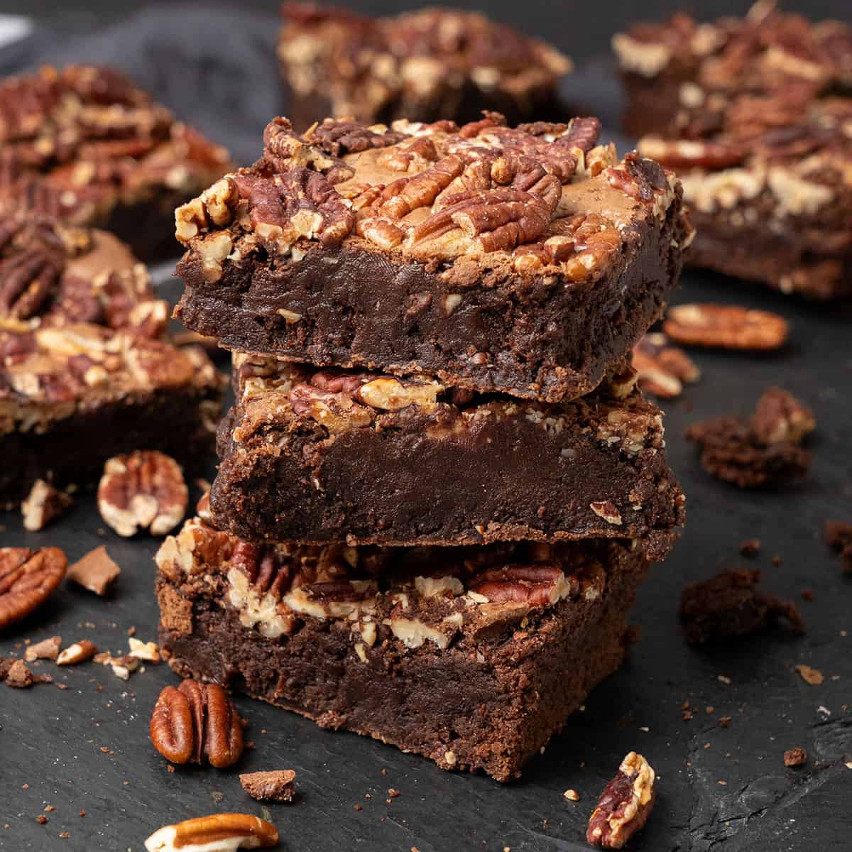 Pecan brownies on a cutting board.