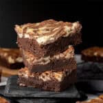 Cheesecake Brownies on a cutting board.